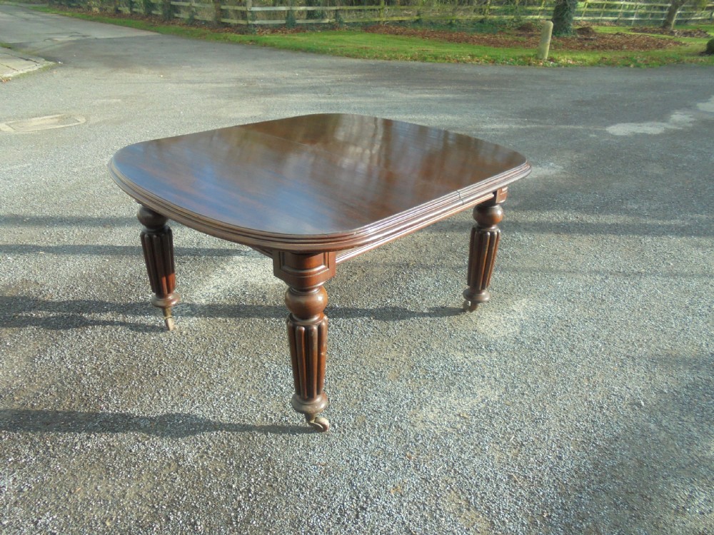 19th century mahogany two leaf extending dining table Seats ten View IX