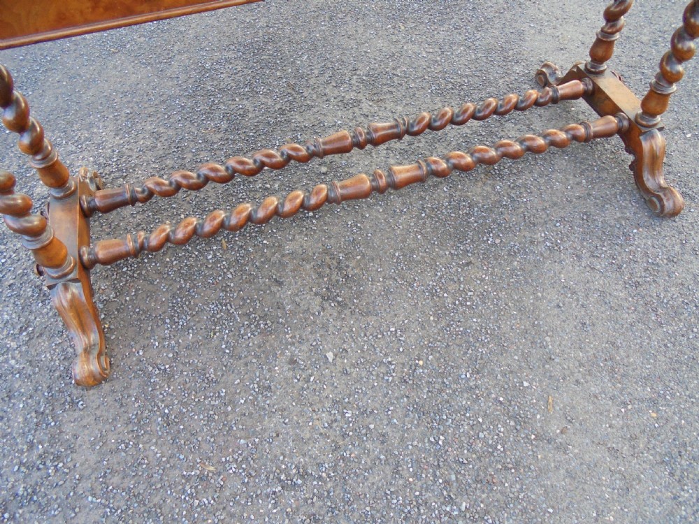 A carved burr walnut writing  ,library table View II