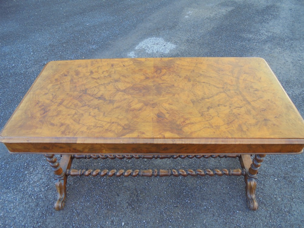 A carved burr walnut writing  ,library table View III