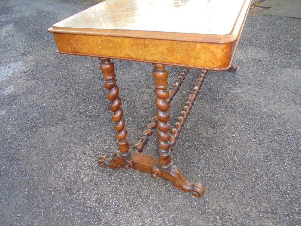 A carved burr walnut writing  ,library table View IV