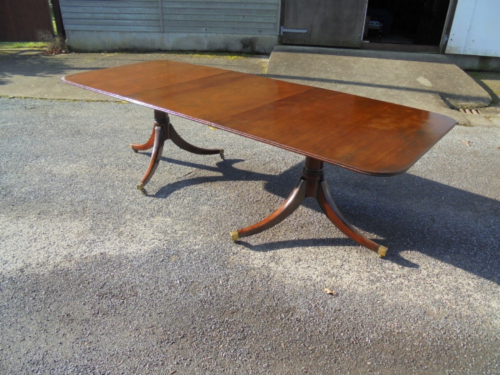 18th century mahogany twin pillar dining table. Seats ten