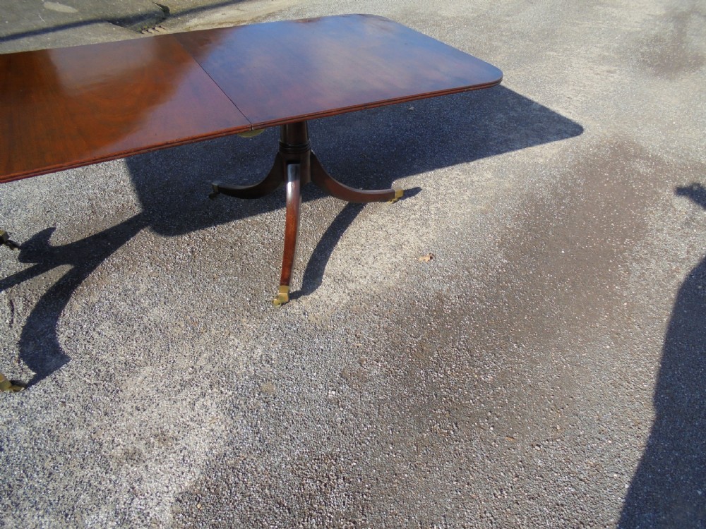 18th century mahogany twin pillar dining table. Seats ten View II