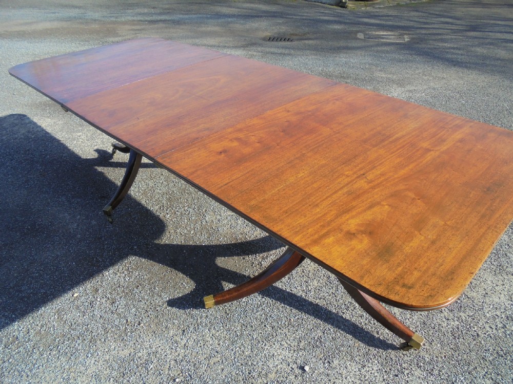 18th century mahogany twin pillar dining table. Seats ten View III
