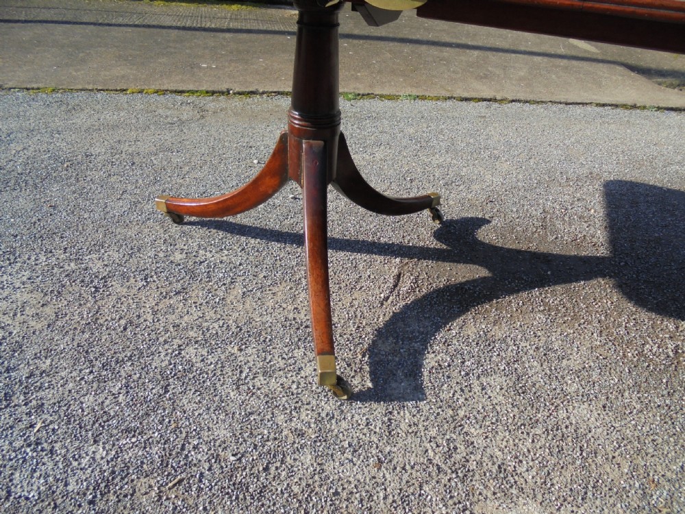 18th century mahogany twin pillar dining table. Seats ten View V