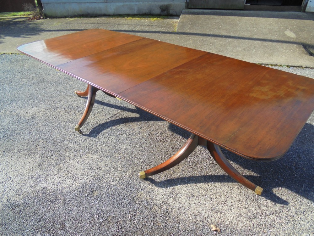 18th century mahogany twin pillar dining table. Seats ten View VI