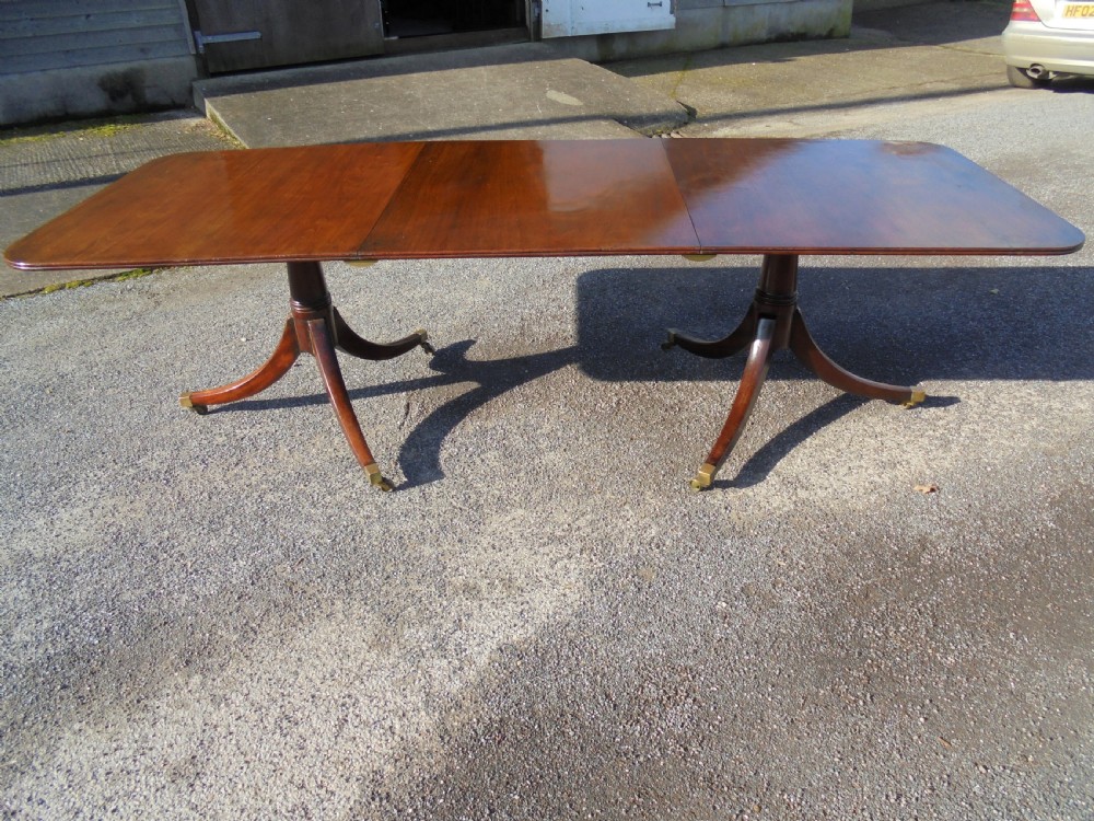 18th century mahogany twin pillar dining table. Seats ten View VII