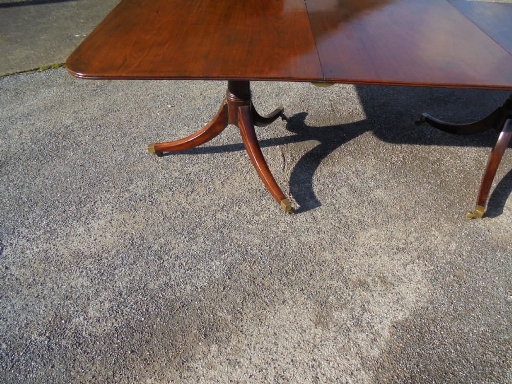 18th century mahogany twin pillar dining table. Seats ten View VIII
