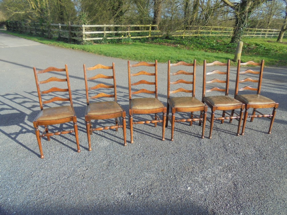 Set of six ladder back chairs with leather seats