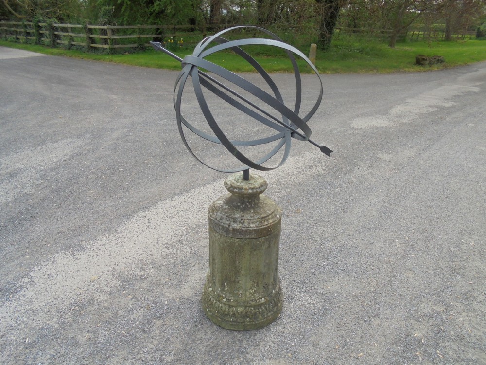 Armillary sphere standing on a weathered stone base