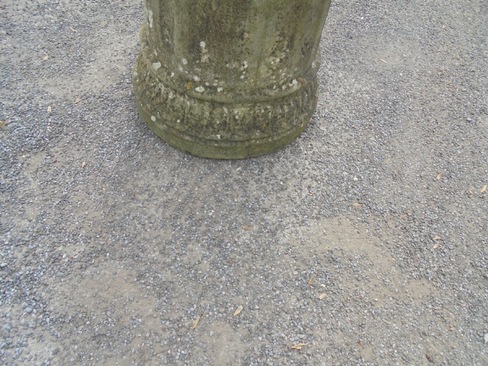 Armillary sphere standing on a weathered stone base View II