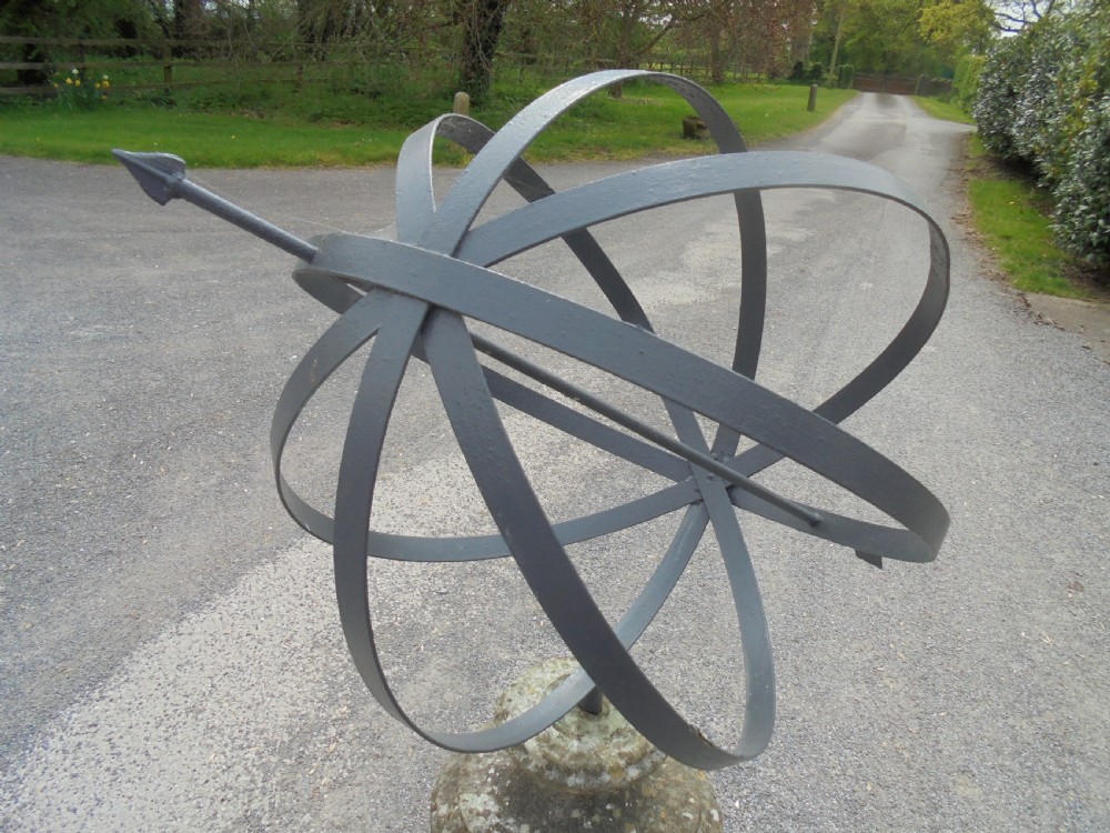 Armillary sphere standing on a weathered stone base View III