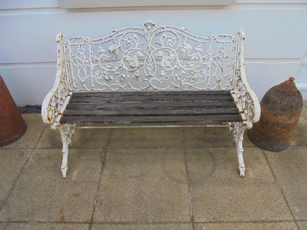 PAIR of Victorian cast iron garden benches