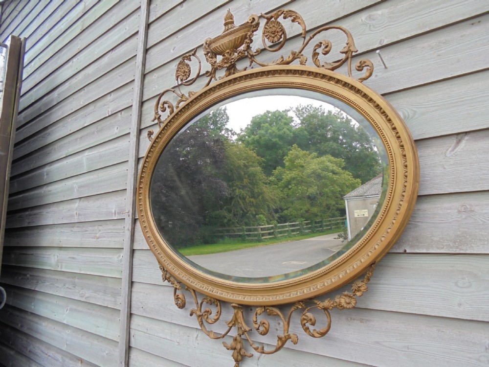 Victorian Adams style gilded oval wall mirror