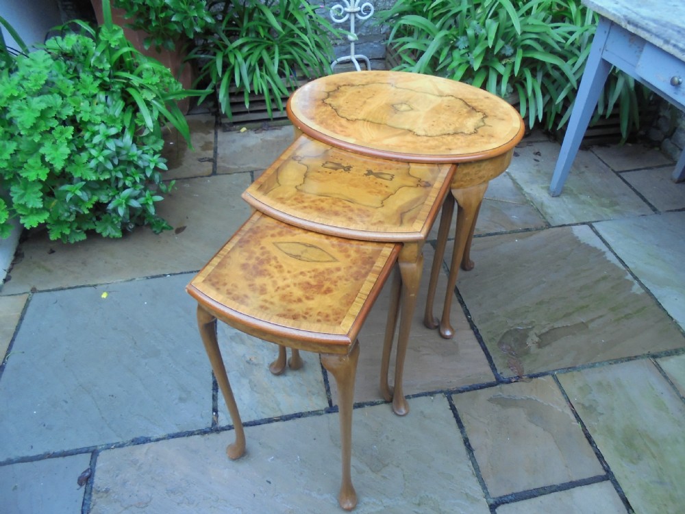 Waring and Gillow walnut nest of three tables.