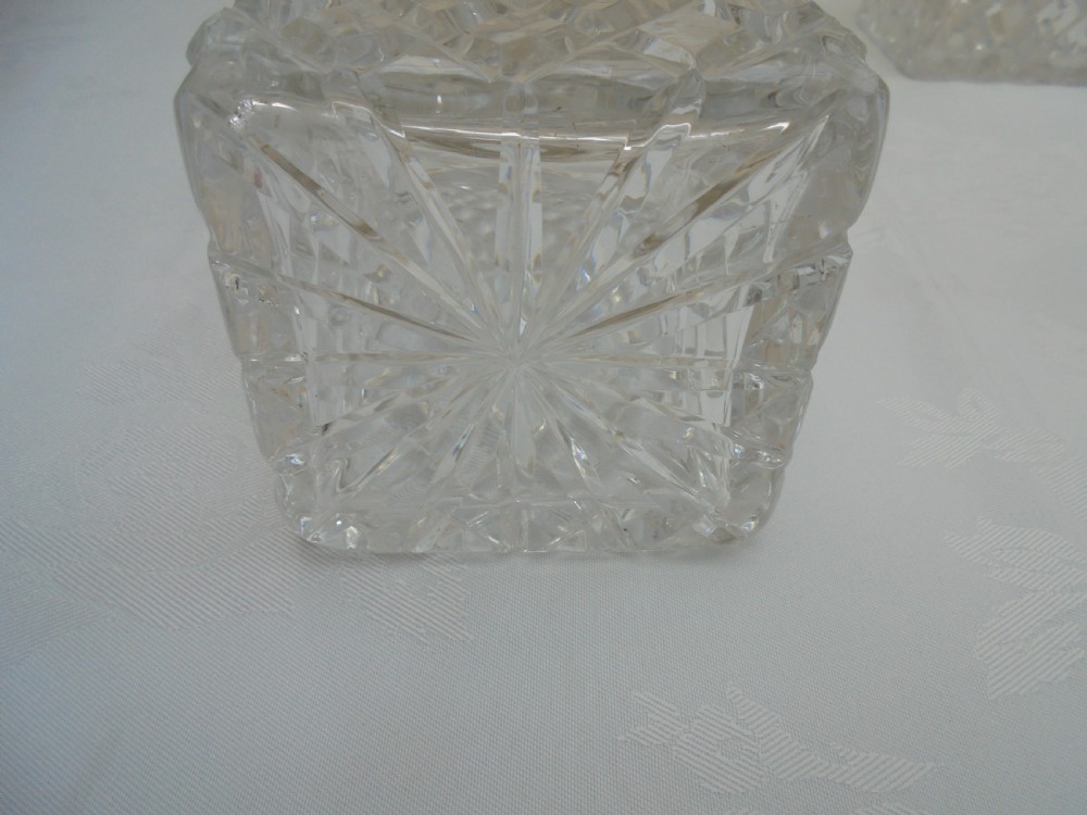 Pair of cut glass, silver top square decanters. View IV