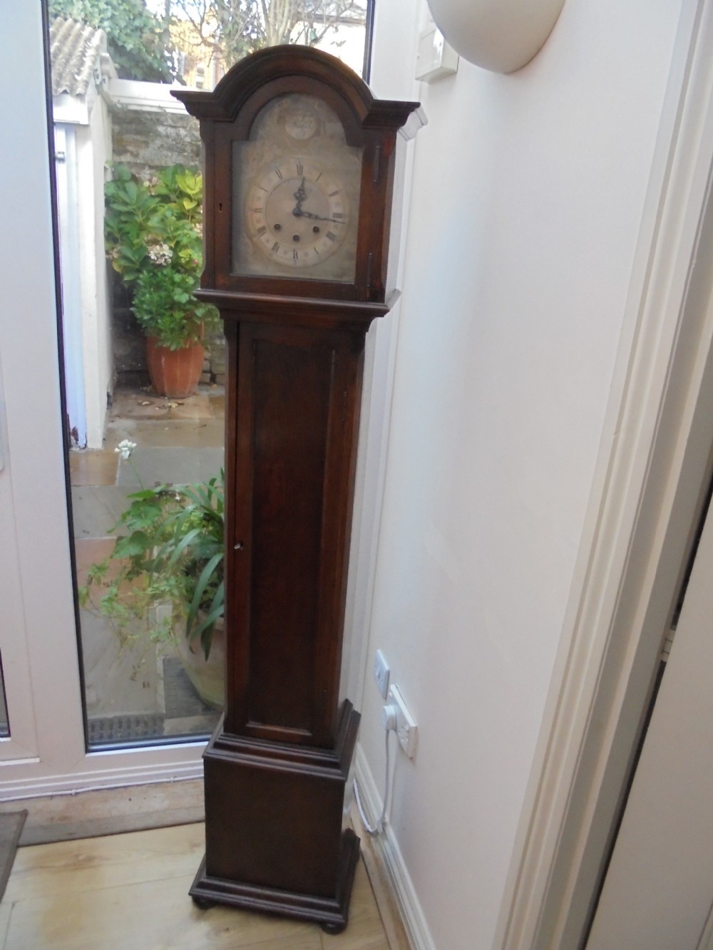 Oak Grandmother clock with silvered dial