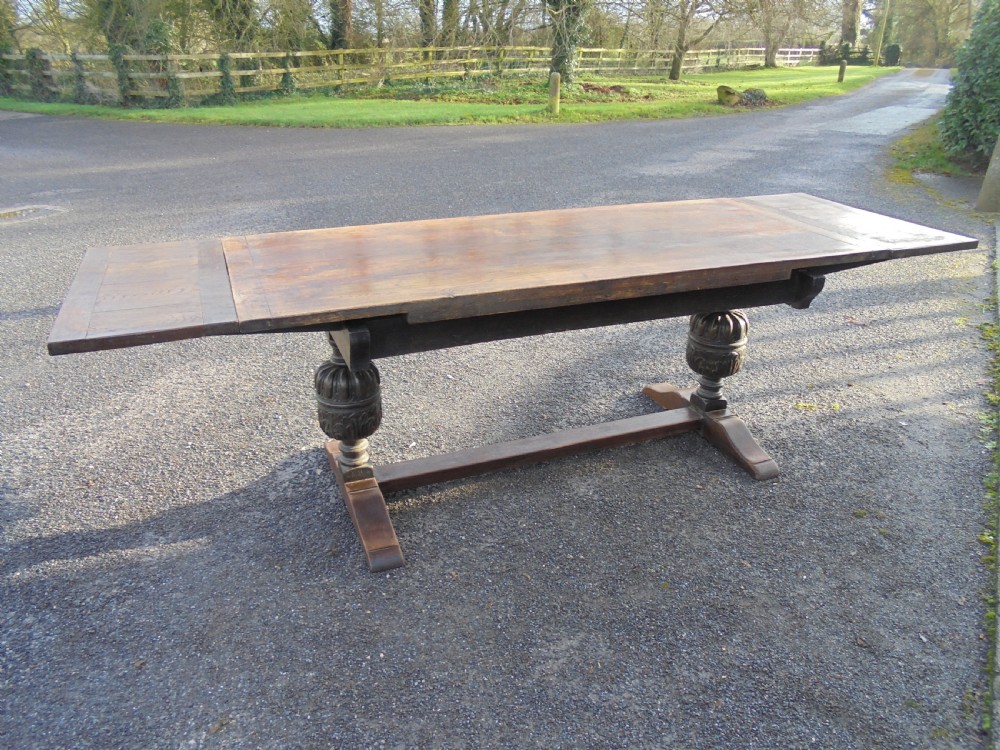 Oak extending refectory dining table seats ten