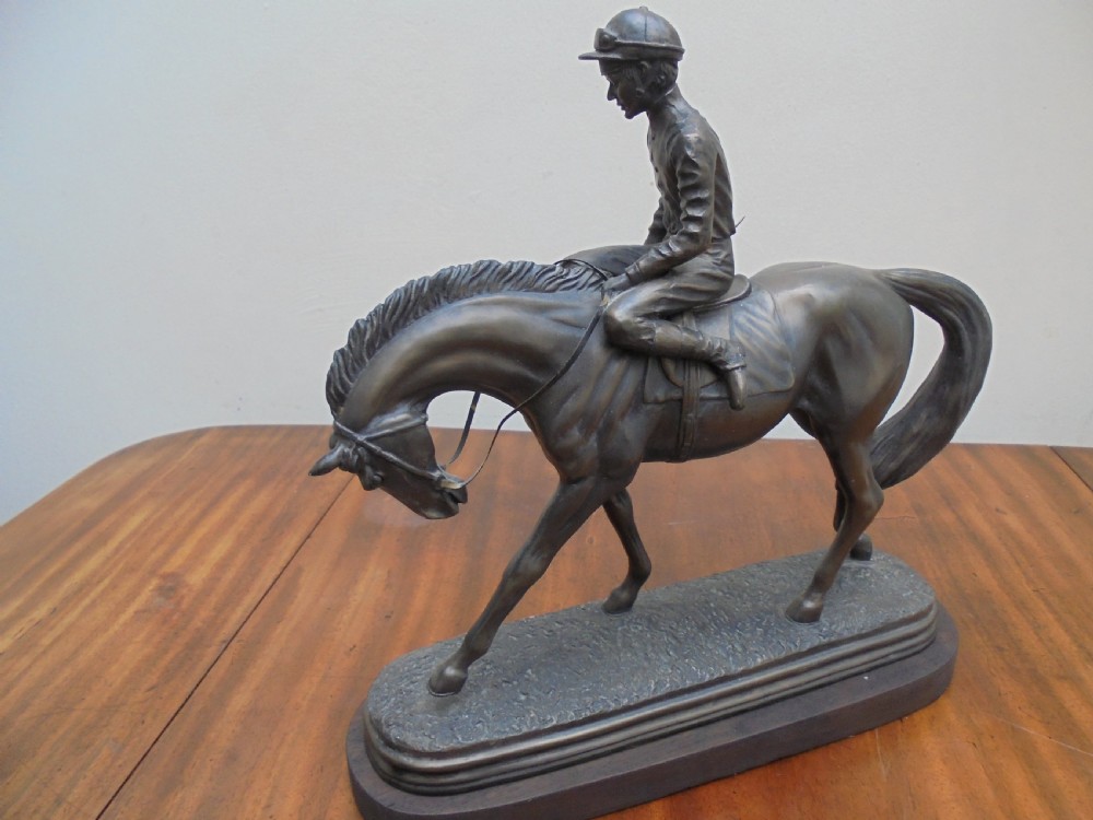 Bronzed jockey on racehorse View II