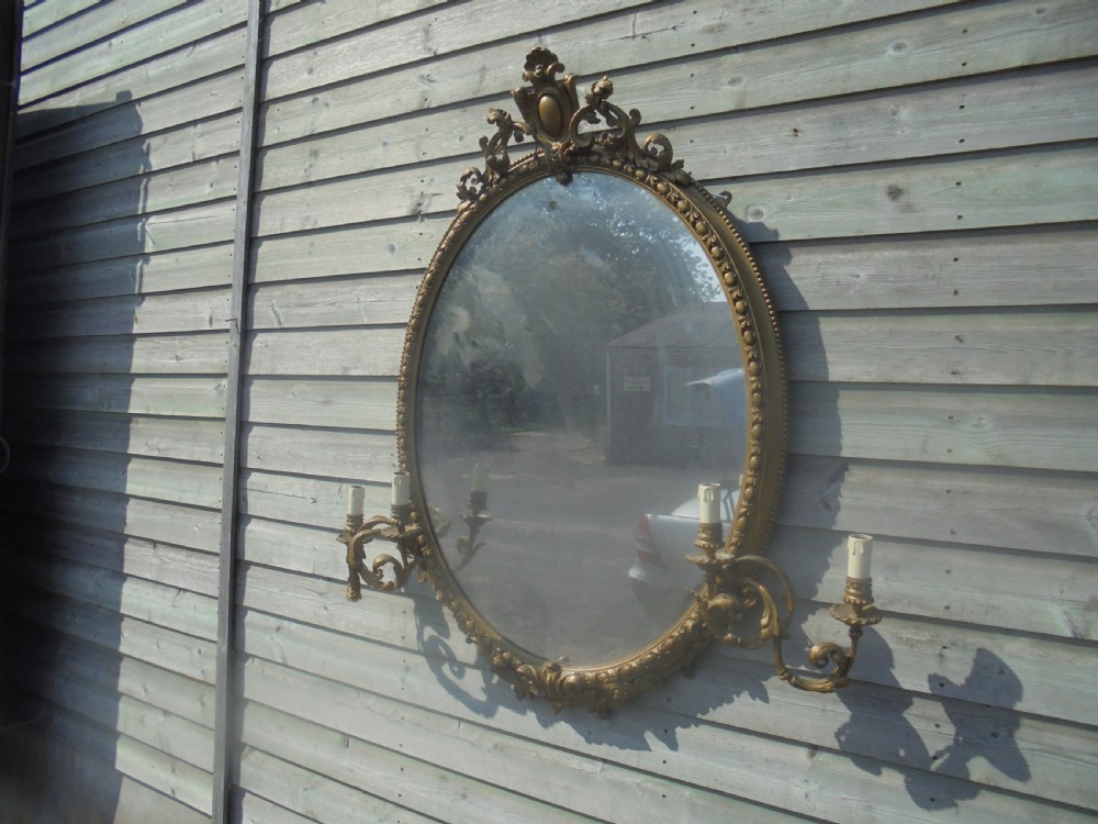 Victorian oval gilded mirror with candelabra View V