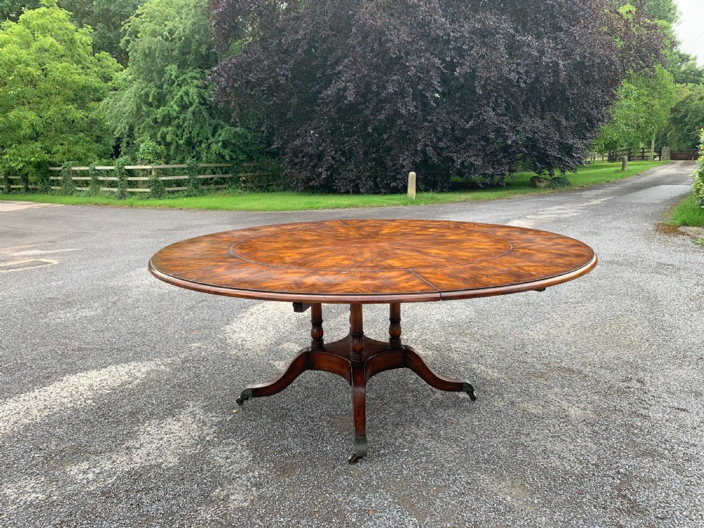 Extending circular dining table seats eight