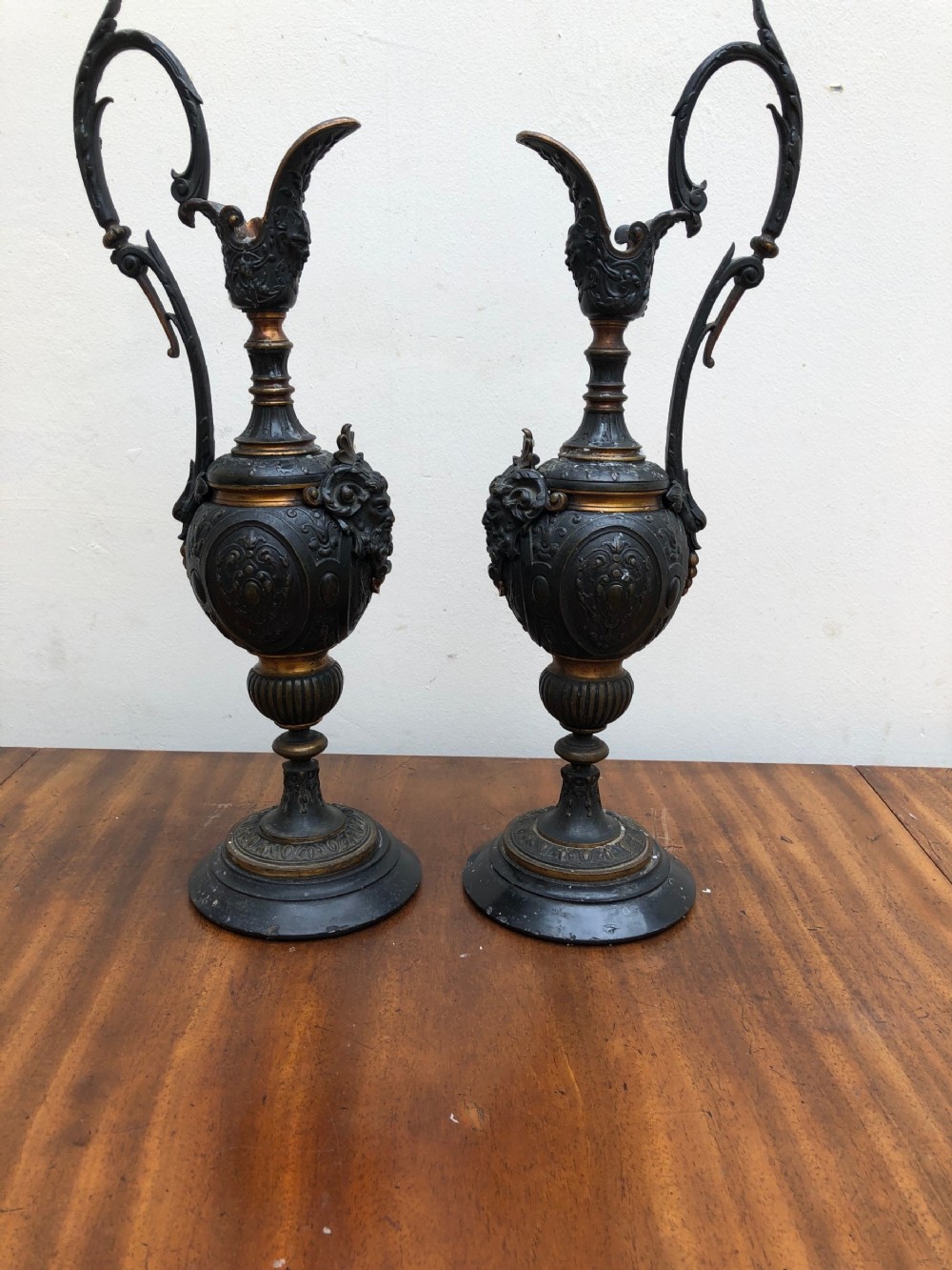 Pair of bronze ewers with gilded banding