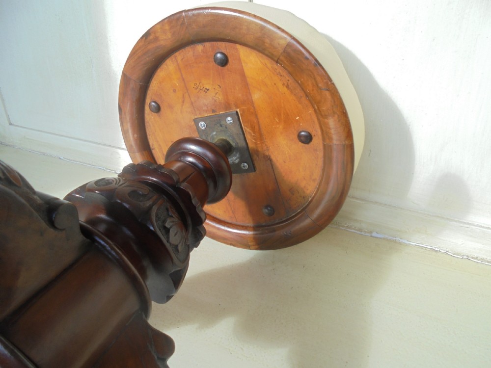 Carved walnut revolving piano stool by Henry Brookes and Co View V
