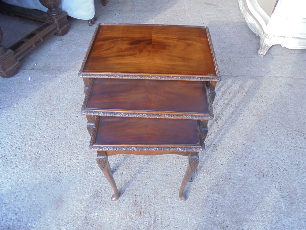 Nest of three mahogany tables