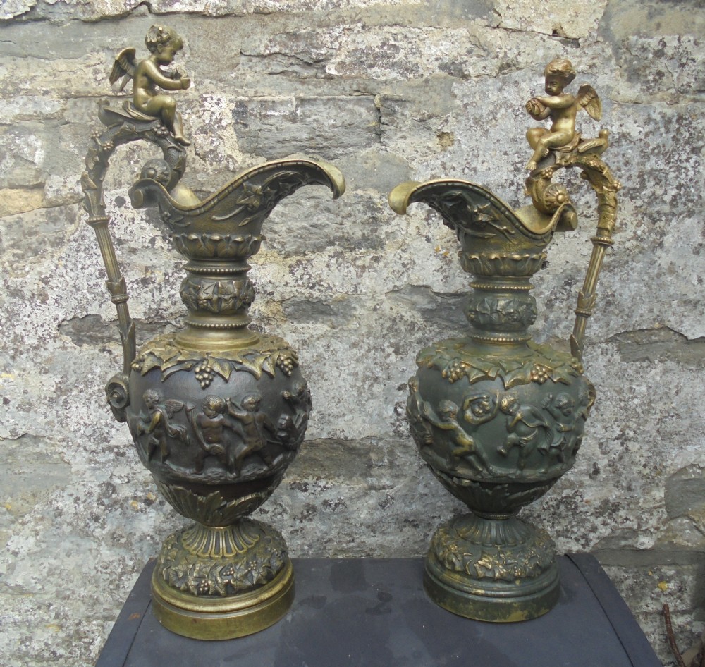 Large pair 19th century bronze ewers with cherubs