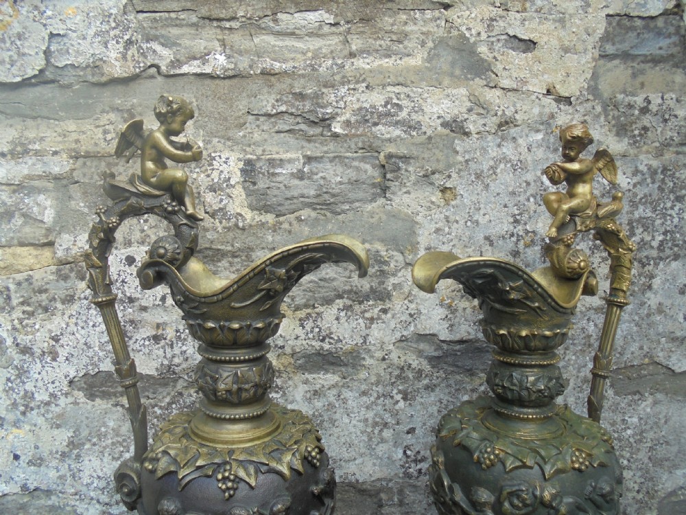 Large pair 19th century bronze ewers with cherubs View V