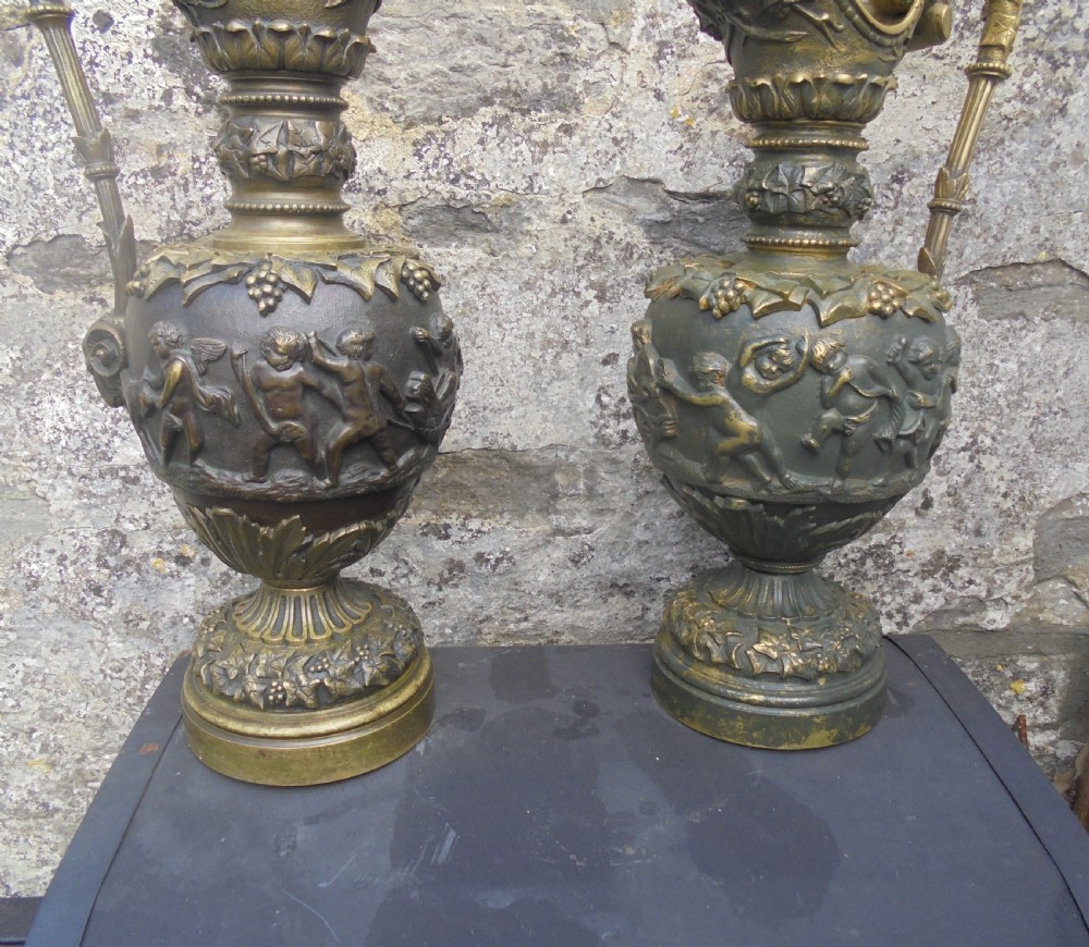 Large pair 19th century bronze ewers with cherubs View VI