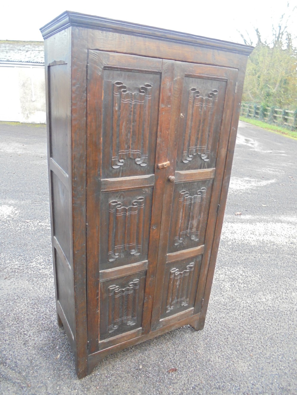 English oak linen fold cupboard storage View III