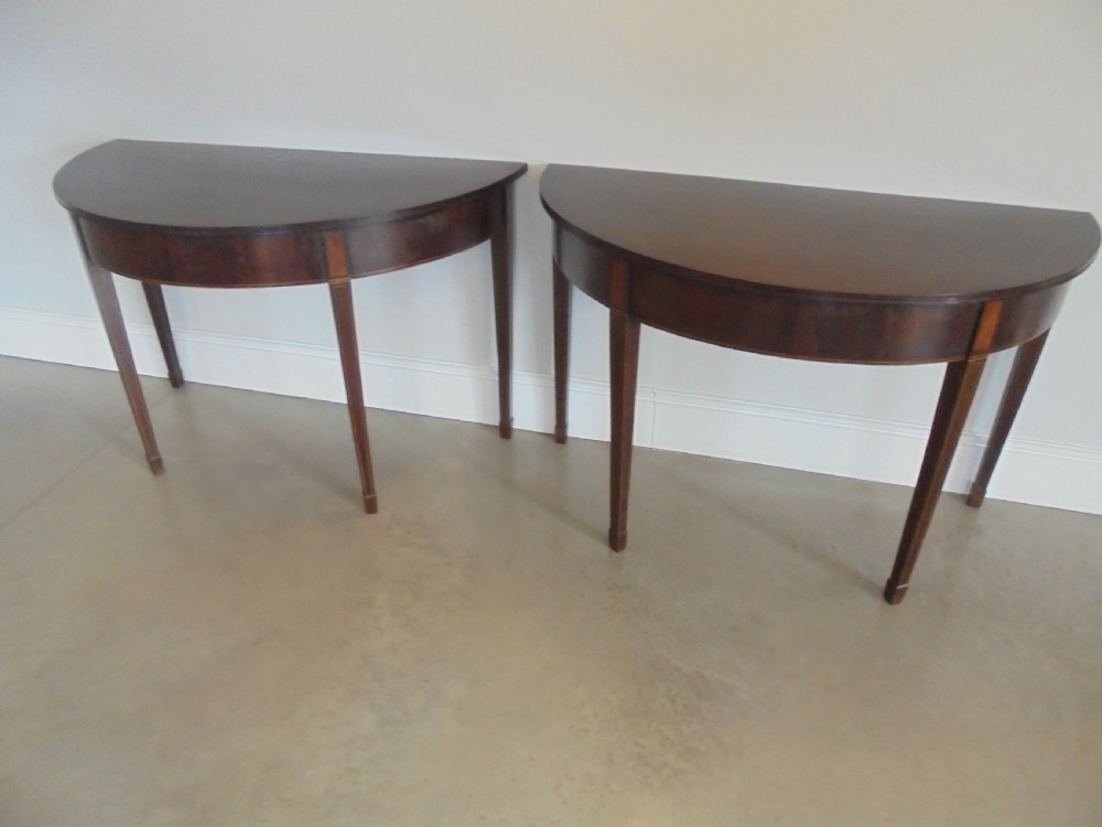 Fine pair of 18th century mahogany demi lune console tables