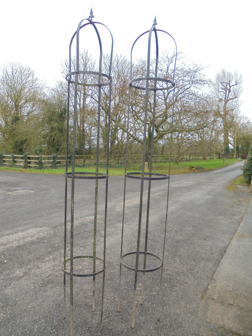 Pair of high wrought steel garden obelisks