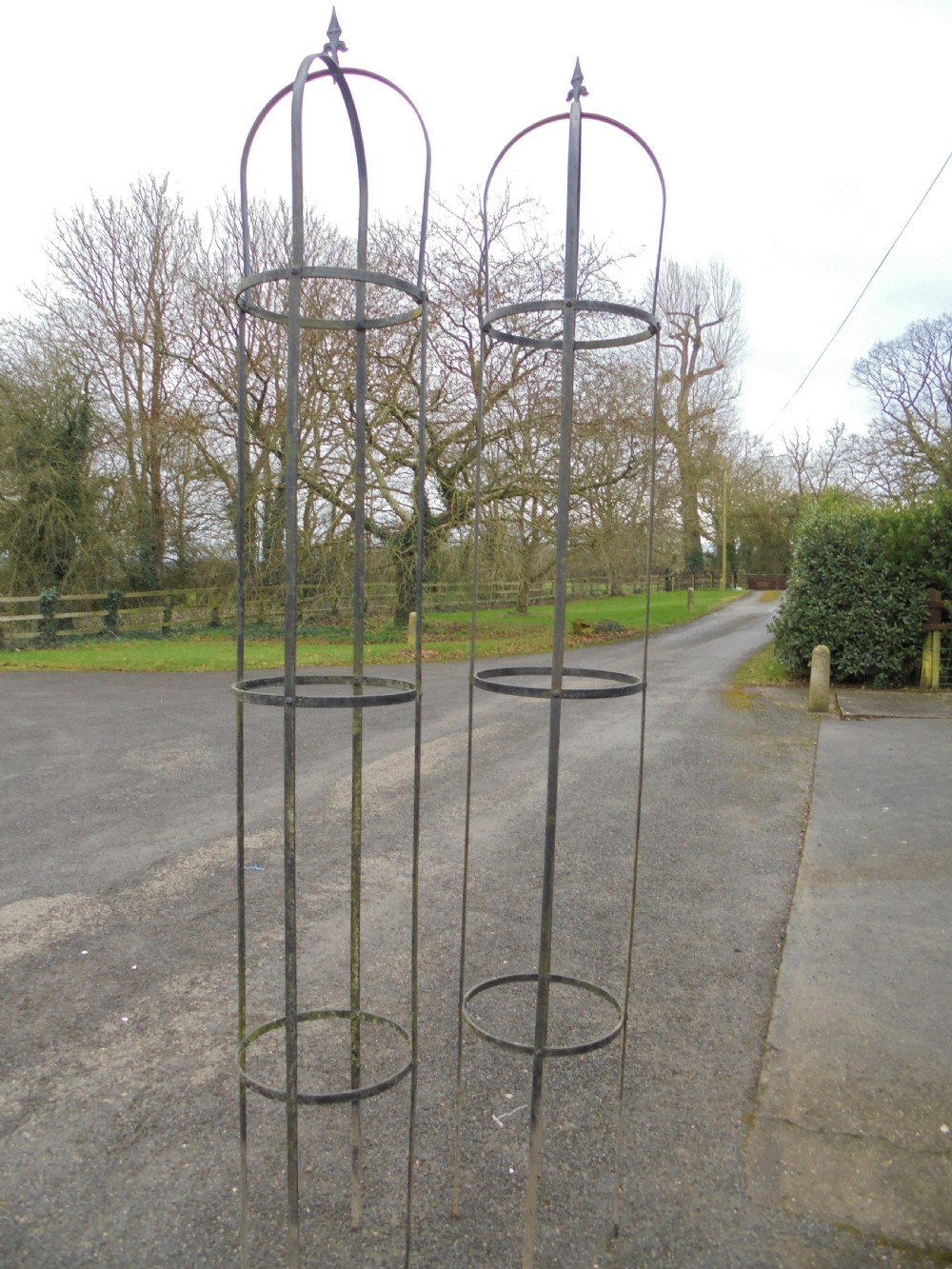 Pair of high wrought steel garden obelisks View II