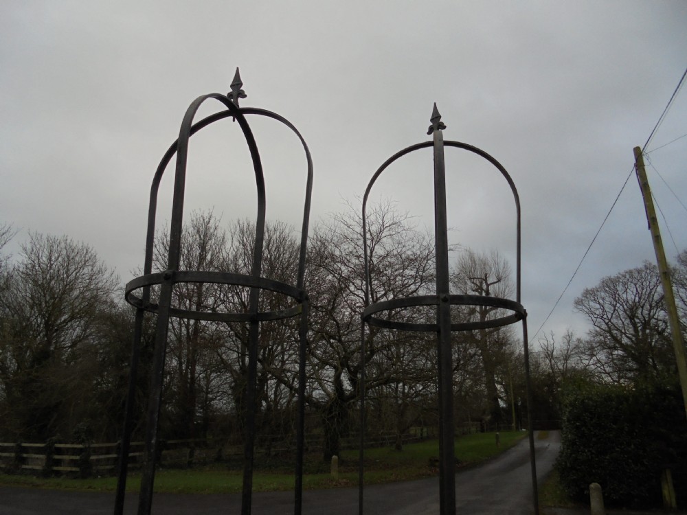 Pair of high wrought steel garden obelisks View III