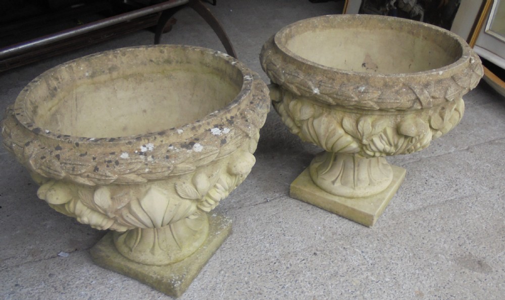 Large pair of weathered stone garden urns View II
