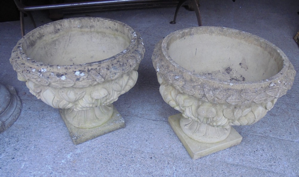 Large pair of weathered stone garden urns View III