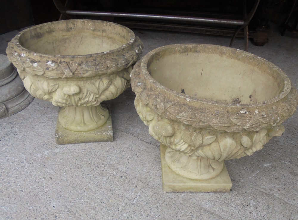 Large pair of weathered stone garden urns View IV