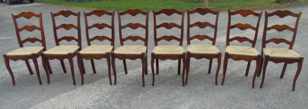 Set of eight French walnut ladder back chairs