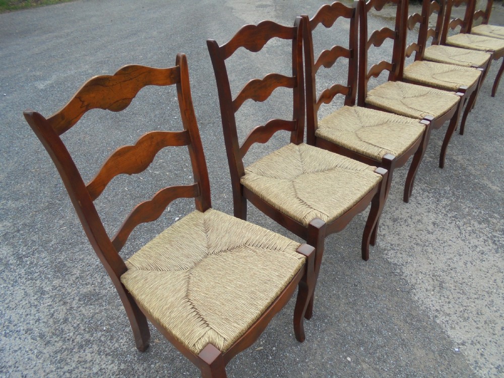 Set of eight French walnut ladder back chairs View II