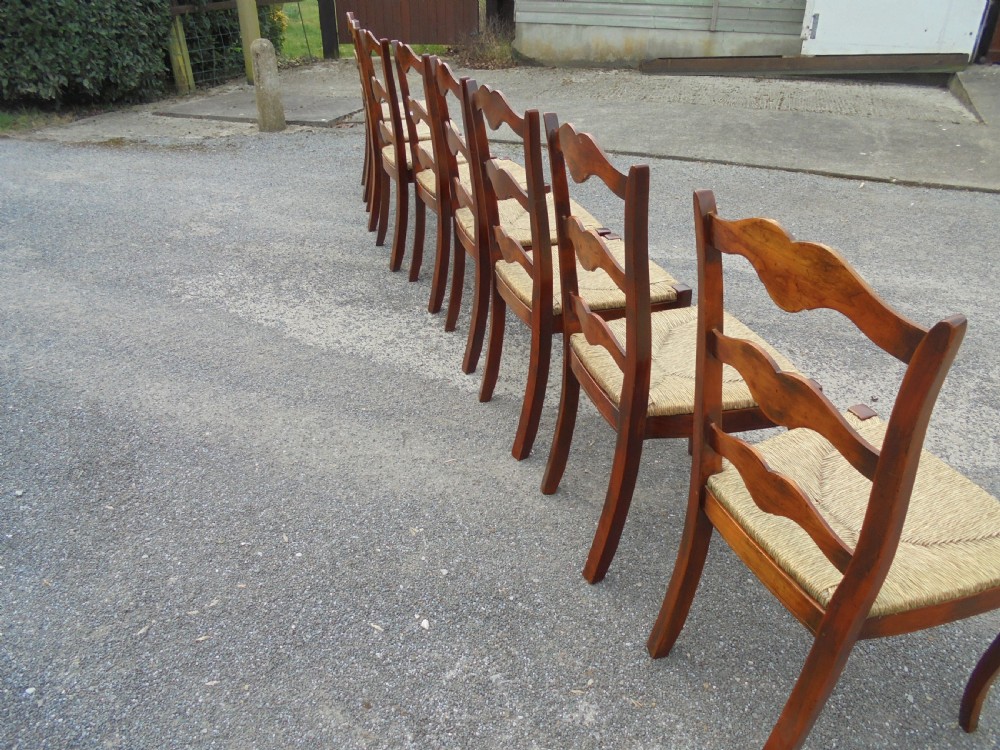 Set of eight French walnut ladder back chairs View IV
