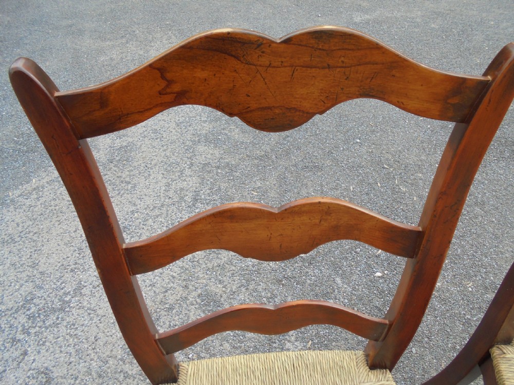 Set of eight French walnut ladder back chairs View V