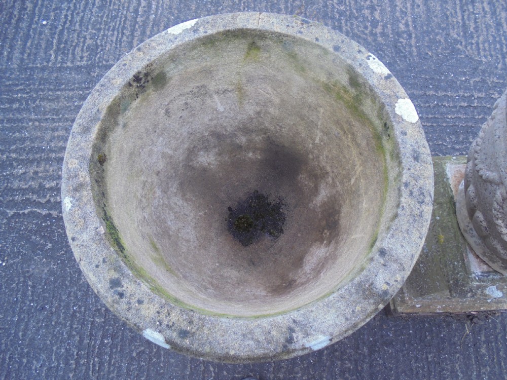 Pair of weathered  sandstone garden urns on stands  View IV