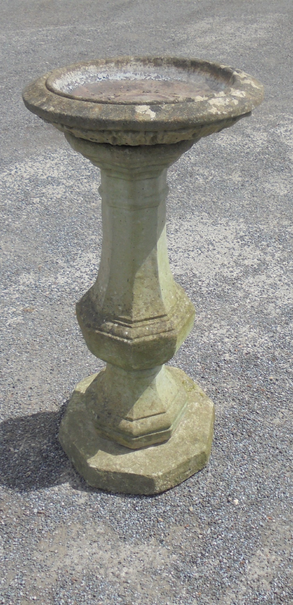 Well shaped and weathered composite stone birdbath