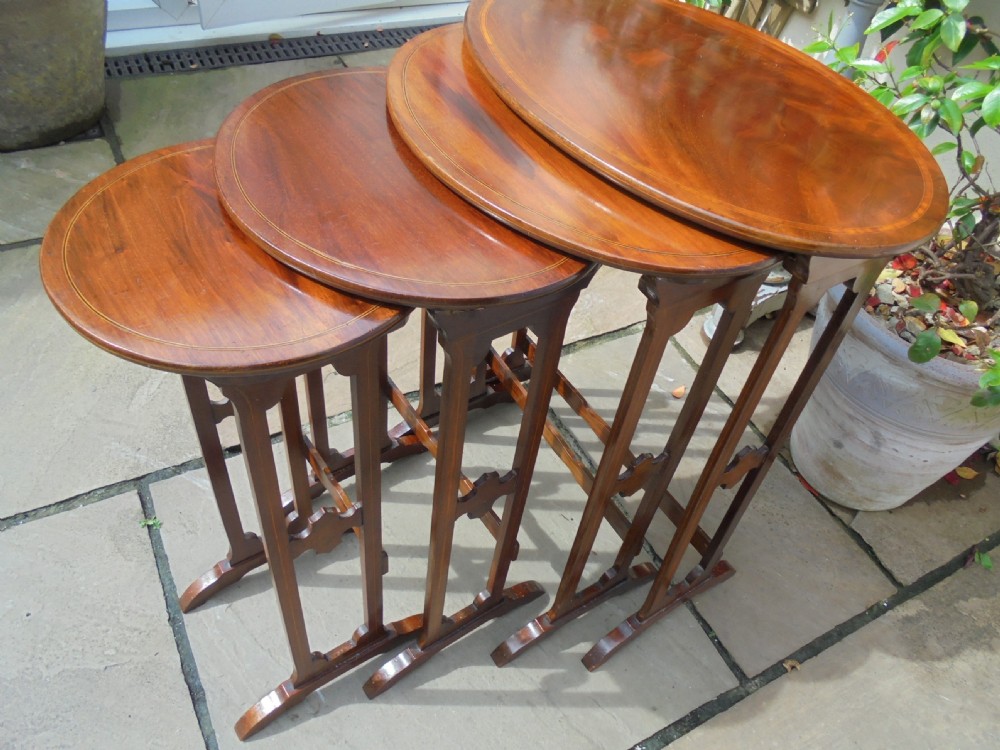 Nest of four oval  inlaid mahogany  occasional lamp tables View V