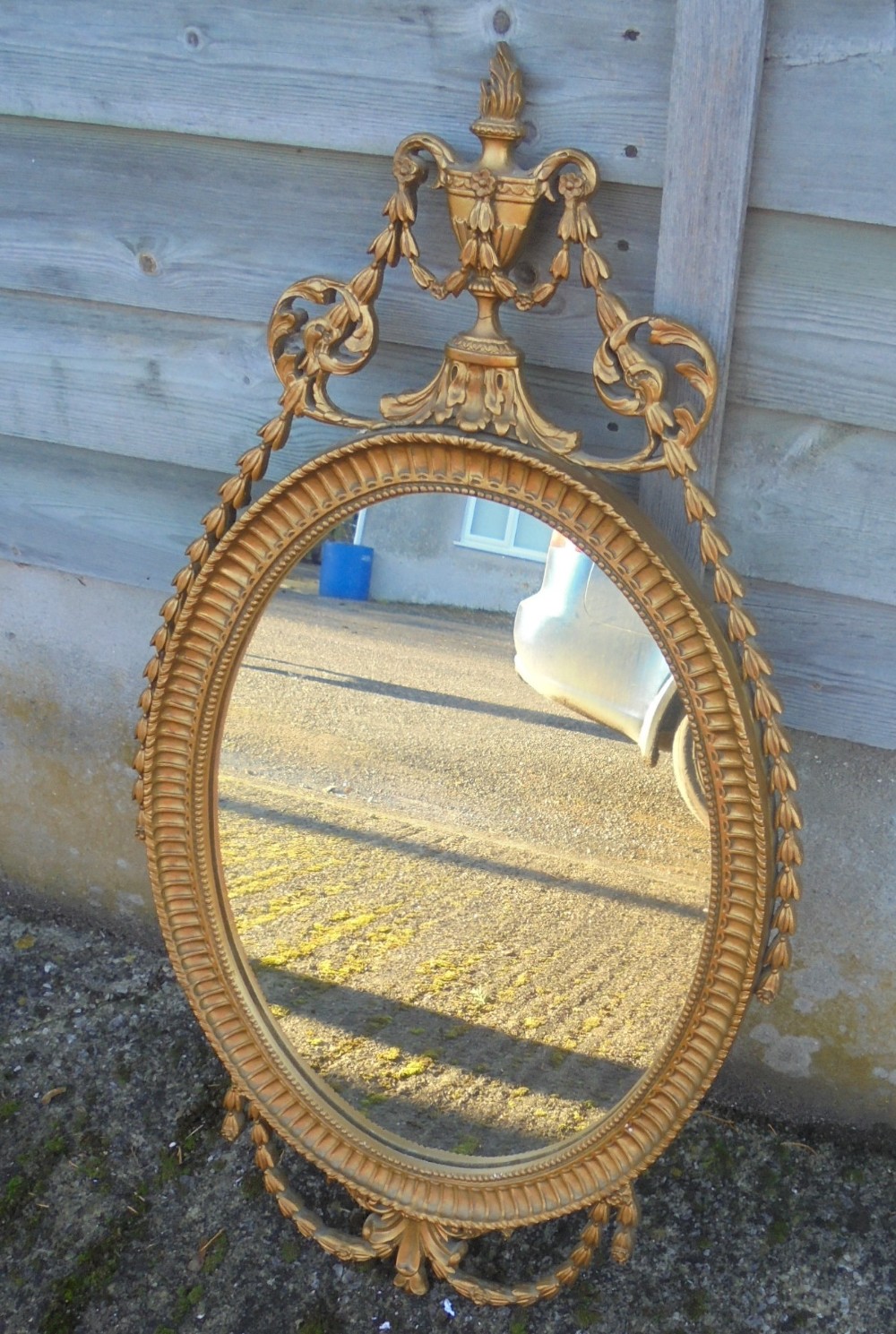 Edwardian oval gilded wall mirror