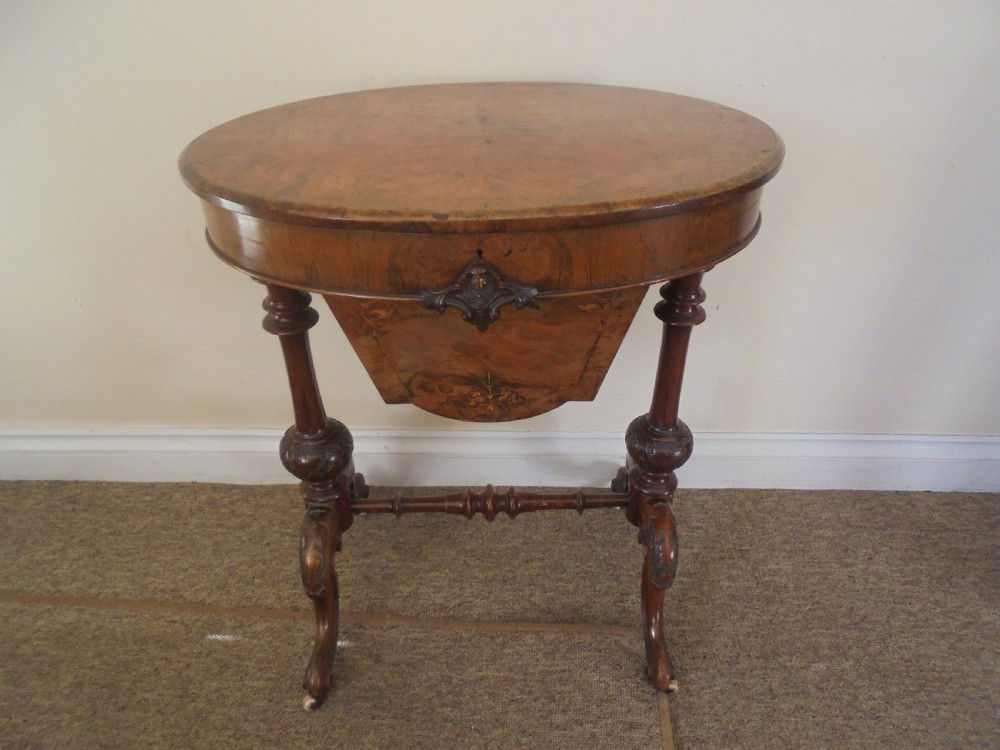 Victorian walnut oval sewing table