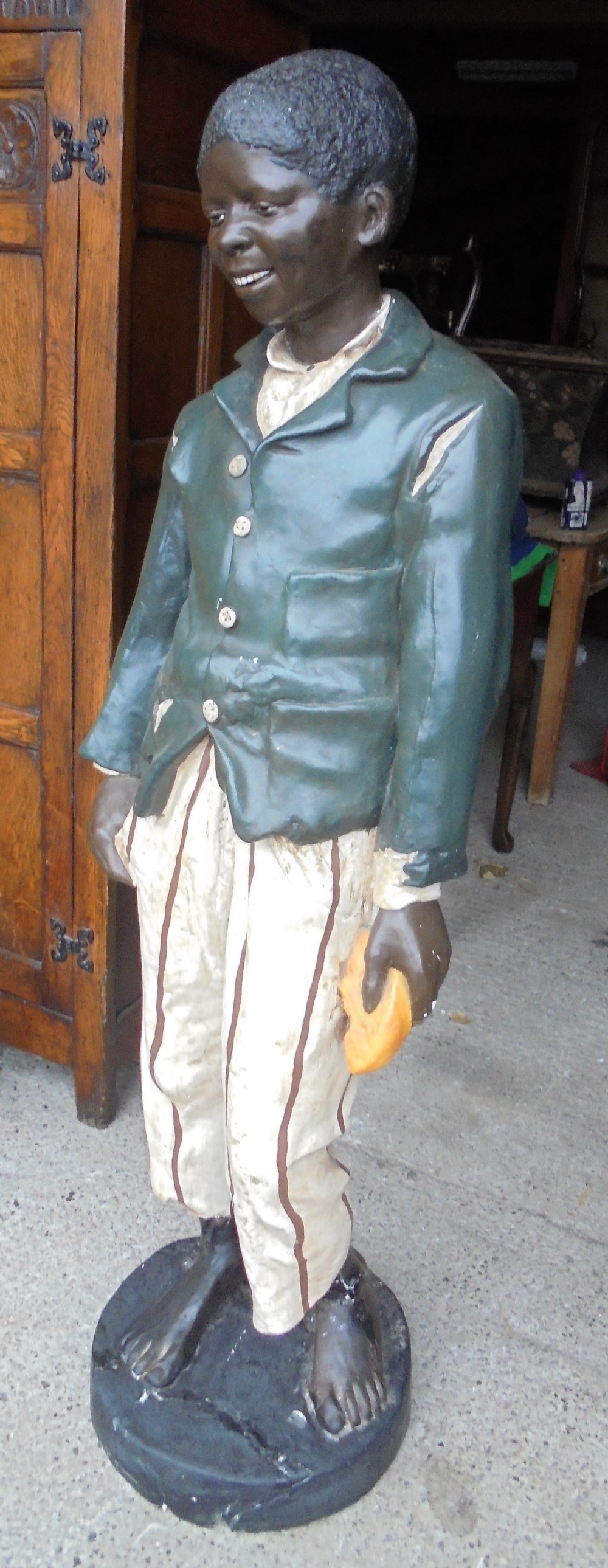 Life size painted plaster figure of  a boy