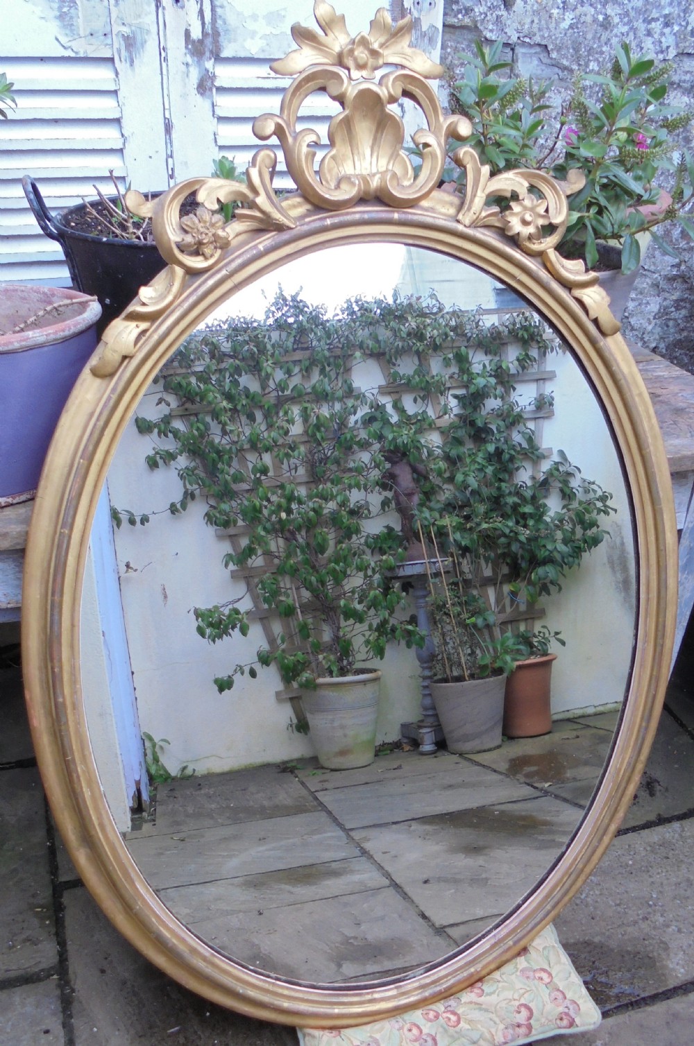 Large 18th century oval gilded wood wall mirror View III