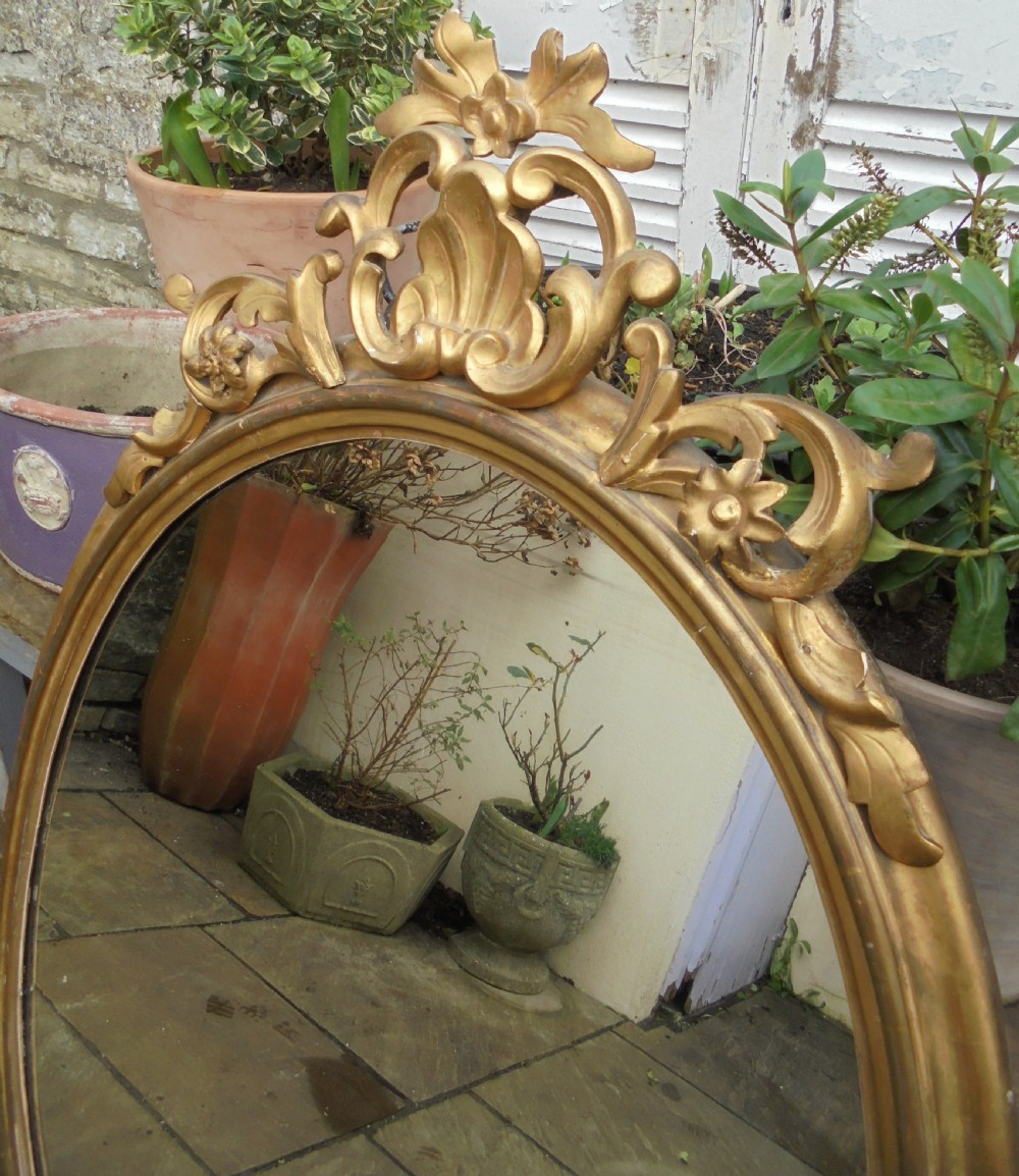 Large 18th century oval gilded wood wall mirror View VI